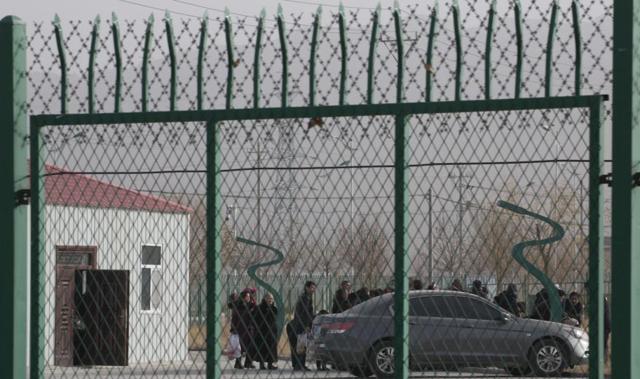 People line up at what China calls a vocational skills education training service center at the Kunshan Industrial Park in Artux in western China’s Xinjiang region. (AP/File photo) People line up at what China calls a vocational skills education training service center at the Kunshan Industrial Park in Artux in western China’s Xinjiang region. (AP/File photo)