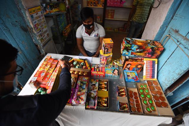 A customer looks to buy green crackers ahead of Diwali festival, at Dariba Kalan, in New Delhi. (PHOTO: Raj K Raj/HT ) A customer looks to buy green crackers ahead of Diwali festival, at Dariba Kalan, in New Delhi. (PHOTO: Raj K Raj/HT )