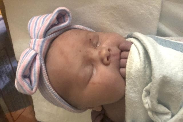 This November 2020 photo provided by Jay Schwandt shows Maggie Schwandt. A Michigan couple whose large family attracted attention by growing to include 14 sons welcomed their first daughter nearly three decades after the birth of their first child. (AP) This November 2020 photo provided by Jay Schwandt shows Maggie Schwandt. A Michigan couple whose large family attracted attention by growing to include 14 sons welcomed their first daughter nearly three decades after the birth of their first child. (AP)