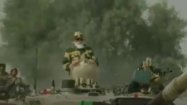 Prime Minister Narendra Modi rides in an Army tank at Longewala in Jaisalmer, Saturday. (Screengrab) Prime Minister Narendra Modi rides in an Army tank at Longewala in Jaisalmer, Saturday. (Screengrab)