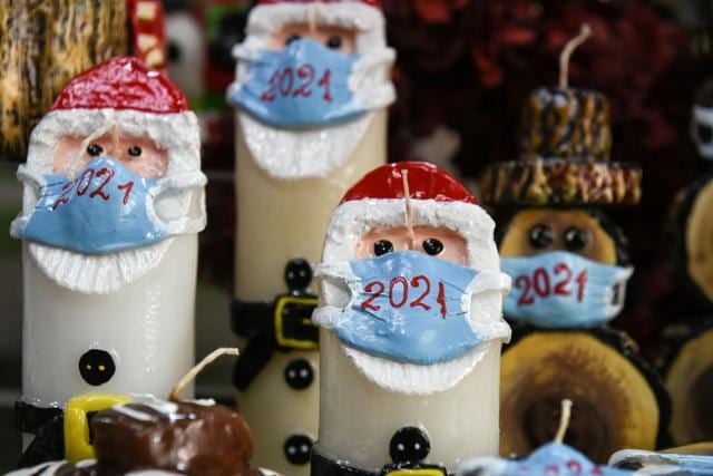 Christmas candles depicting Santa Claus wearing a protective mask are displayed at the shop of candlemaker Alexis Gerakis, as the COVID-19 pandemic continues, in Thessaloniki, Greece. (REUTERS) Christmas candles depicting Santa Claus wearing a protective mask are displayed at the shop of candlemaker Alexis Gerakis, as the COVID-19 pandemic continues, in Thessaloniki, Greece. (REUTERS)