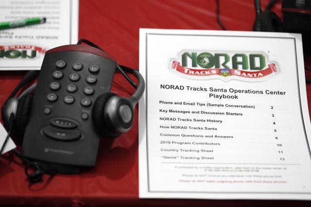 The image shows a playbook kept next to a telephone set up in the NORAD Tracks Santa center at Peterson Air Force Base in Colorado Springs, Colo. (AP) The image shows a playbook kept next to a telephone set up in the NORAD Tracks Santa center at Peterson Air Force Base in Colorado Springs, Colo. (AP)