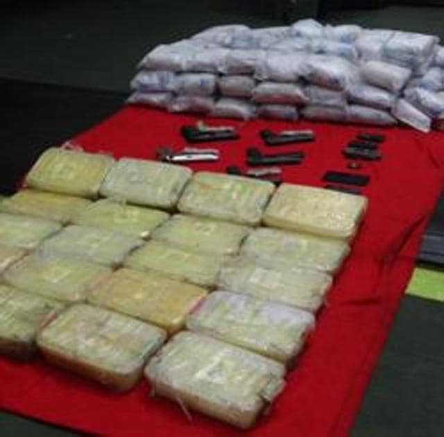 The Indian Coast Guard has seized 99 packets of heroin, 20 small boxes of synthetic drugs and five 9mm pistols from the boat (Sourced) The Indian Coast Guard has seized 99 packets of heroin, 20 small boxes of synthetic drugs and five 9mm pistols from the boat (Sourced)