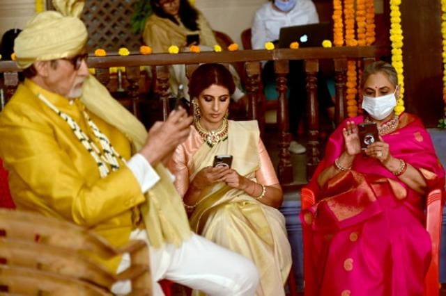 The Bachchans take a break during a shoot. The Bachchans take a break during a shoot.