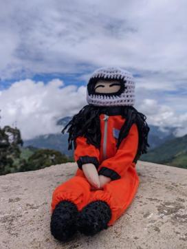 The doll inspired by Indian-origin American astronaut Kalpana Chawla wears a hand-knitted helmet and orange spacesuit. The doll inspired by Indian-origin American astronaut Kalpana Chawla wears a hand-knitted helmet and orange spacesuit.