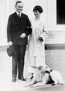 FILE - In this Nov. 5, 1924, file photo President Calvin Coolidge and first lady Grace Coolidge are shown with their dog at the White House portico in Washington. The arrival of the Biden pets will also mark the next chapter in a long history of pets residing at the White House after a four-year hiatus during the Trump administration. “Pets have always played an important role in the White House throughout the decades,” said Jennifer Pickens, an author who studies White House traditions. (AP Photo, File) (AP) FILE - In this Nov. 5, 1924, file photo President Calvin Coolidge and first lady Grace Coolidge are shown with their dog at the White House portico in Washington. The arrival of the Biden pets will also mark the next chapter in a long history of pets residing at the White House after a four-year hiatus during the Trump administration. “Pets have always played an important role in the White House throughout the decades,” said Jennifer Pickens, an author who studies White House traditions. (AP Photo, File) (AP)