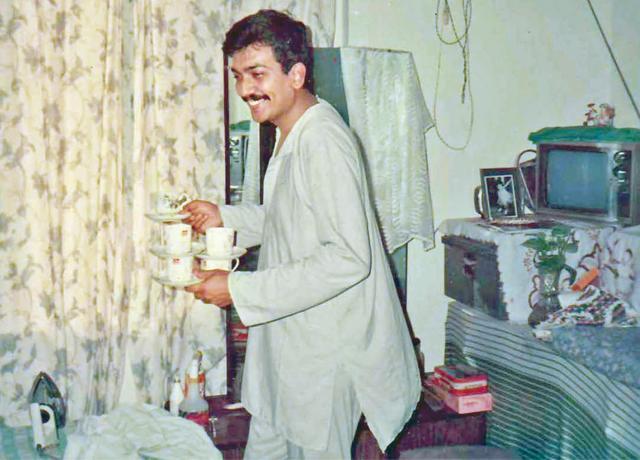 Sanjeev making chai for guests at home in Delhi Sanjeev making chai for guests at home in Delhi
