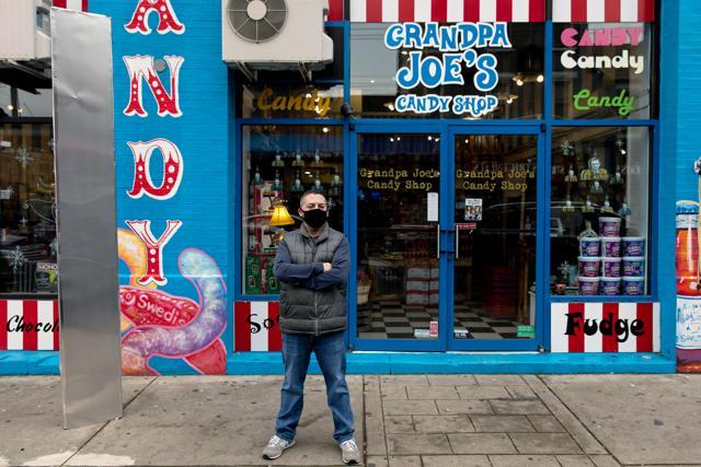 Christopher Beers, owner of Grandpa Joe's Candy Shop, stands near a monolith outside his store in Pittsburgh, Pennsylvania, U.S, (REUTERS) Christopher Beers, owner of Grandpa Joe's Candy Shop, stands near a monolith outside his store in Pittsburgh, Pennsylvania, U.S, (REUTERS)