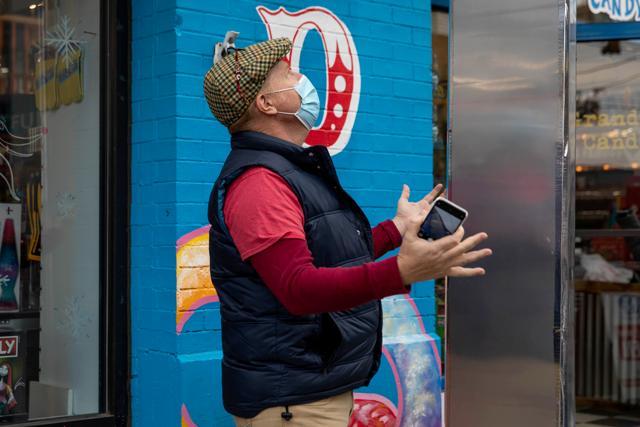 A man reacts to seeing a monolith that appeared outside Grandpa Joe's Candy Shop in Pittsburgh, Pennsylvania, U.S. (REUTERS) A man reacts to seeing a monolith that appeared outside Grandpa Joe's Candy Shop in Pittsburgh, Pennsylvania, U.S. (REUTERS)