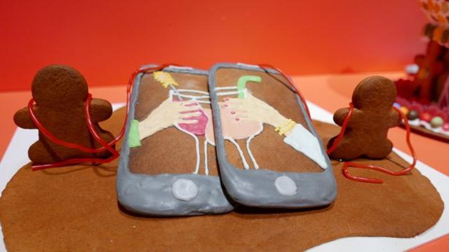 Two gingerbread smartphones to illustrate social distancing are seen during the annual gingerbread baking competition at Arkdes Museum of Architecture and Design in Stockholm, Sweden. (REUTERS) Two gingerbread smartphones to illustrate social distancing are seen during the annual gingerbread baking competition at Arkdes Museum of Architecture and Design in Stockholm, Sweden. (REUTERS)