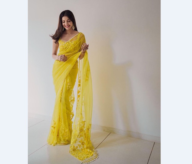 Actor Kajal Aggarwal in a bright yellow Manish Malhotra sari at her engagement (Photo: Instagram/KajalAggarwalofficial)