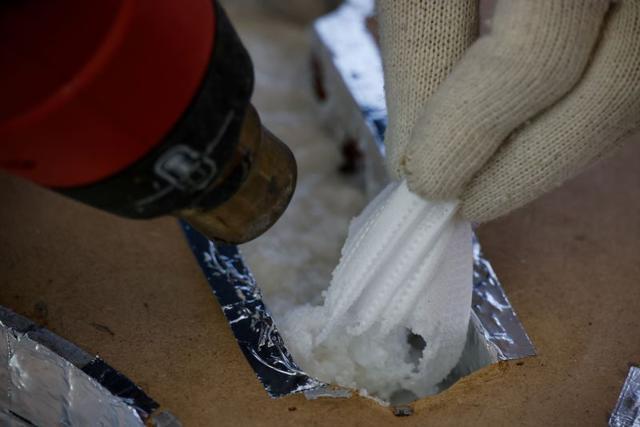 Discarded protective masks are melted for upcycling by Kim Ha-neul who is majoring in furniture design, in Uiwang, South Korea. (REUTERS) Discarded protective masks are melted for upcycling by Kim Ha-neul who is majoring in furniture design, in Uiwang, South Korea. (REUTERS)