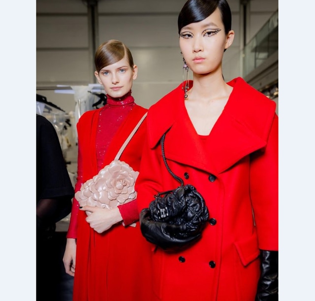 Models in red statement coats from Valentino AW 20 (Photo: Instagram/MaisonValentino)