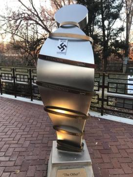 Boise : In this photo provided by the Wassmuth Center for Human Rights, a swastika sticker is seen on a sculpture at the Idaho Anne Frank Human Rights Memorial in Boise, Idaho, on Tuesday, Dec. 8, 2020. Boise police are investigating after the memorial was defaced by swastika stickers earlier this week. The stickers, which included the words, "we are everywhere" as well as the Nazi insignia, were discovered Tuesday morning by a visitor to the memorial in downtown Boise. (AP)