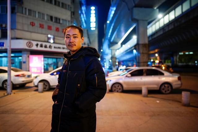 An Junming poses for a picture on a street, almost a year after the global outbreak of the coronavirus disease (COVID-19) in Wuhan, Hubei province, China December 15, 2020. Junming who worked as a volunteer during the city's lockdown delivering food to people said: "At that time, I could only eat one meal a day, because there was indeed a lot of work to do, but there were very few people doing it, so I was very anxious." (REUTERS) An Junming poses for a picture on a street, almost a year after the global outbreak of the coronavirus disease (COVID-19) in Wuhan, Hubei province, China December 15, 2020. Junming who worked as a volunteer during the city's lockdown delivering food to people said: "At that time, I could only eat one meal a day, because there was indeed a lot of work to do, but there were very few people doing it, so I was very anxious." (REUTERS)