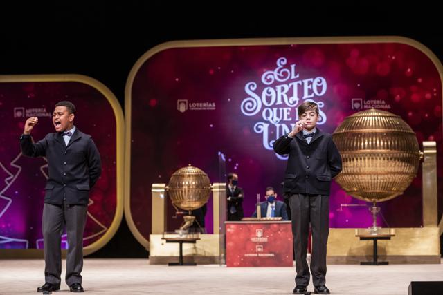 Children from Madrids San Ildefonso school sing out the winning Christmas lottery number 72897 at Madrids Teatro Real opera house during Spains bumper Christmas lottery draw known as El Gordo, or The Fat One, in Madrid, Spain. (AP) Children from Madrids San Ildefonso school sing out the winning Christmas lottery number 72897 at Madrids Teatro Real opera house during Spains bumper Christmas lottery draw known as El Gordo, or The Fat One, in Madrid, Spain. (AP)