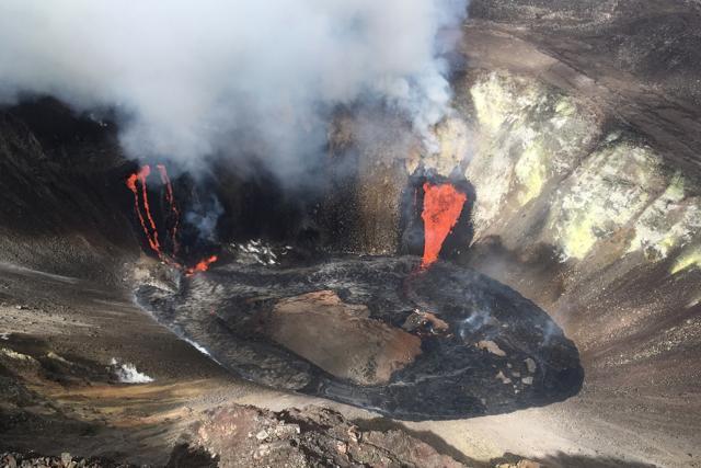 A plume rises near active fissures in the crater of Hawaii's Kilauea volcano on Monday, Dec. 21, 2020. People are lining up to try to get a look at the volcano on the Big Island, which erupted last night and spewed ash and steam into the atmosphere. (AP) A plume rises near active fissures in the crater of Hawaii's Kilauea volcano on Monday, Dec. 21, 2020. People are lining up to try to get a look at the volcano on the Big Island, which erupted last night and spewed ash and steam into the atmosphere. (AP)
