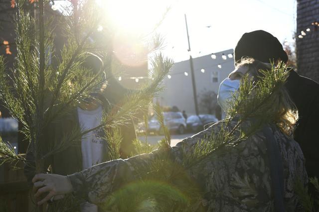 Parker Vivier (R), of Richmond, looks at a tree to buy at Frank Pichel's tree lot. (AP) Parker Vivier (R), of Richmond, looks at a tree to buy at Frank Pichel's tree lot. (AP)