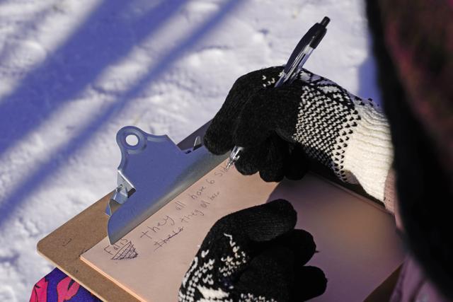 Fourth grader Falis Asair makes notes while wearing gloves during an outdoor class at the Gerald Talbot School, in Portland, Maine. (AP) Fourth grader Falis Asair makes notes while wearing gloves during an outdoor class at the Gerald Talbot School, in Portland, Maine. (AP)