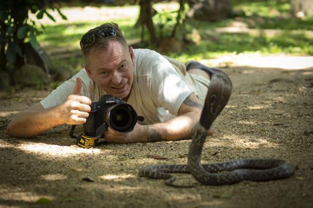 Roger Brendhagen taking the photograph of a snake. (Roger Brendhagen)