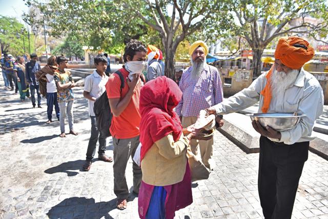 Stranded migrant workers and homeless people were supported with food by residents of Delhi-NCR. (Photo: HT/Sanchit Khanna) Stranded migrant workers and homeless people were supported with food by residents of Delhi-NCR. (Photo: HT/Sanchit Khanna)