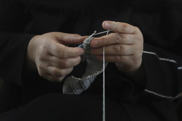 Maliheh Rahimi crochets at a workshop of Bavar charity in Tehran, Iran. (AP) Maliheh Rahimi crochets at a workshop of Bavar charity in Tehran, Iran. (AP)