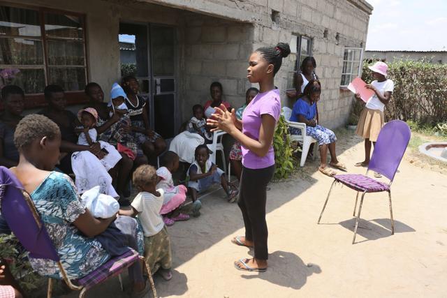 Natsiraishe Maritsa, right, talks to teen mothers in the Epworth settlement about 15 km southeast of the capital Harare. In Zimbabwe, where girls as young as 10 are forced to marry due to poverty or traditional and religious practices, a teenage martial arts fan 17-year old Natsiraishe Maritsa is using the sport to give girls in an impoverished community a fighting chance at life. (AP) Natsiraishe Maritsa, right, talks to teen mothers in the Epworth settlement about 15 km southeast of the capital Harare. In Zimbabwe, where girls as young as 10 are forced to marry due to poverty or traditional and religious practices, a teenage martial arts fan 17-year old Natsiraishe Maritsa is using the sport to give girls in an impoverished community a fighting chance at life. (AP)