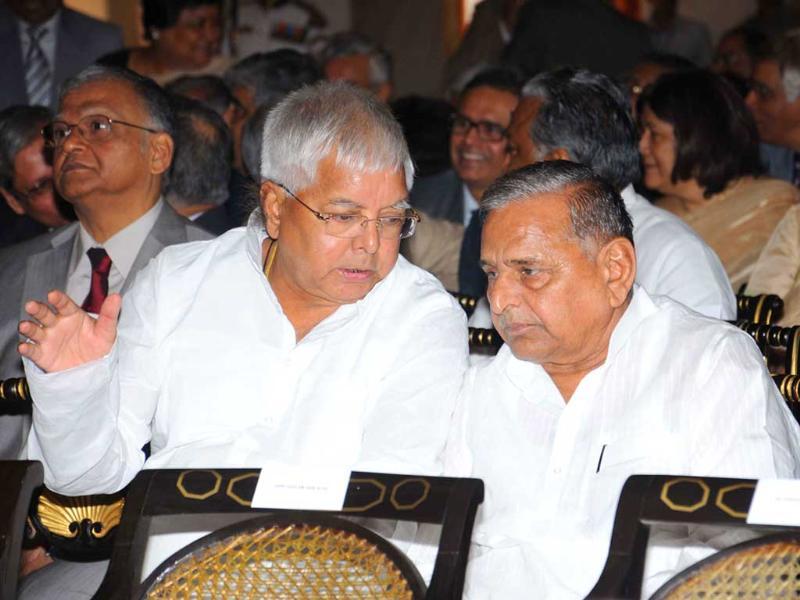 Samajwadi Party supremo Mulayam Singh Yadav and RJD chief Lalu Prasad are seen during the swearing in ceremony of new Chief Justice of India Altamas Kabir at Rashtrapati Bhavan in New Delhi. PTI