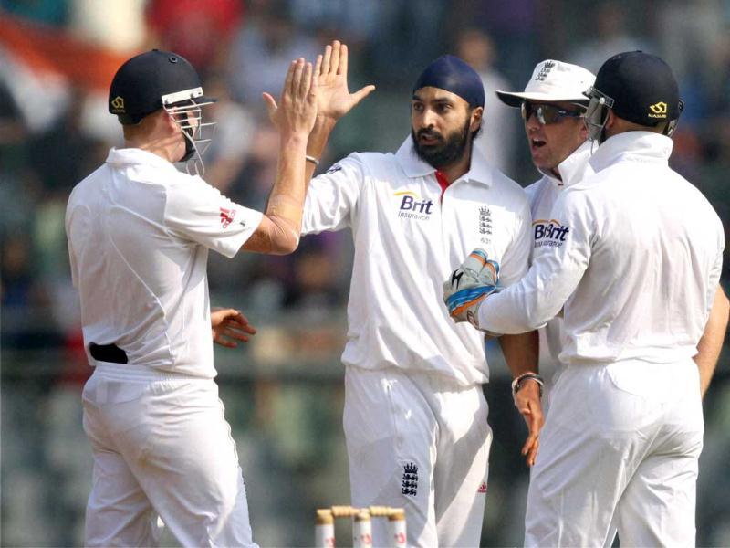 England's Monty Panesar celebrates the wicket of R Ashwin with teammates during Day 2 of second India-England test match at Wankhade Stadium in Mumbai.(PTI) England's Monty Panesar celebrates the wicket of R Ashwin with teammates during Day 2 of second India-England test match at Wankhade Stadium in Mumbai.(PTI)