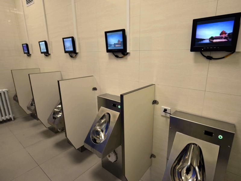 This is the public toilet equipped with Wi-Fi, a bank ATM machine and chargers for mobile phones and electric vehicles in Beijing. (AFP)