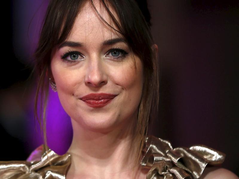 Star Dakota Johnson, famous for her role as Anastasia Steele in Fifty Shades of Grey poses for photographers at the European premiere of How to be Single. (REUTERS) Star Dakota Johnson, famous for her role as Anastasia Steele in Fifty Shades of Grey poses for photographers at the European premiere of How to be Single. (REUTERS)