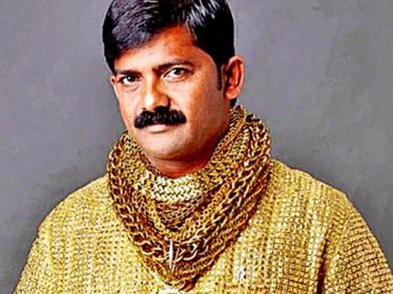 indian man gold shirt