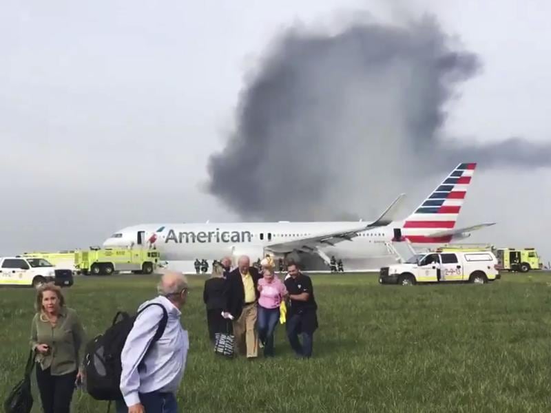 The burning plane Flight evacuated at Chicago airport after engine