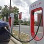 Tesla vehicle charges at a Tesla Supercharger site in Charlotte, N.C.