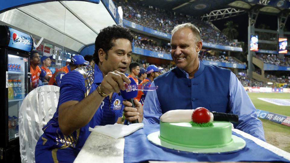 Sachin Tendulkar cuts a cake on his 40th birthday, as his wife Anjali looks  on | ESPNcricinfo.com