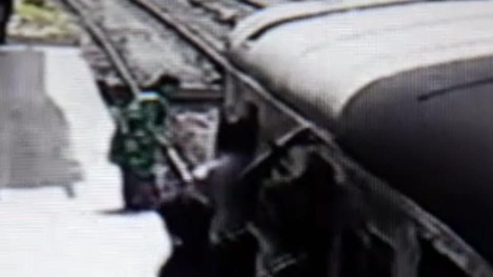 WATCH How Mumbai woman jumps in front of fullspeed train, escapes
