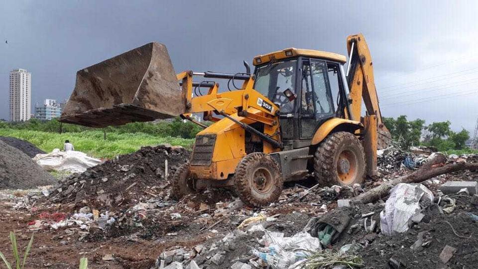 Mumbai Trucks dumping debris on wetlands seized Mumbai news