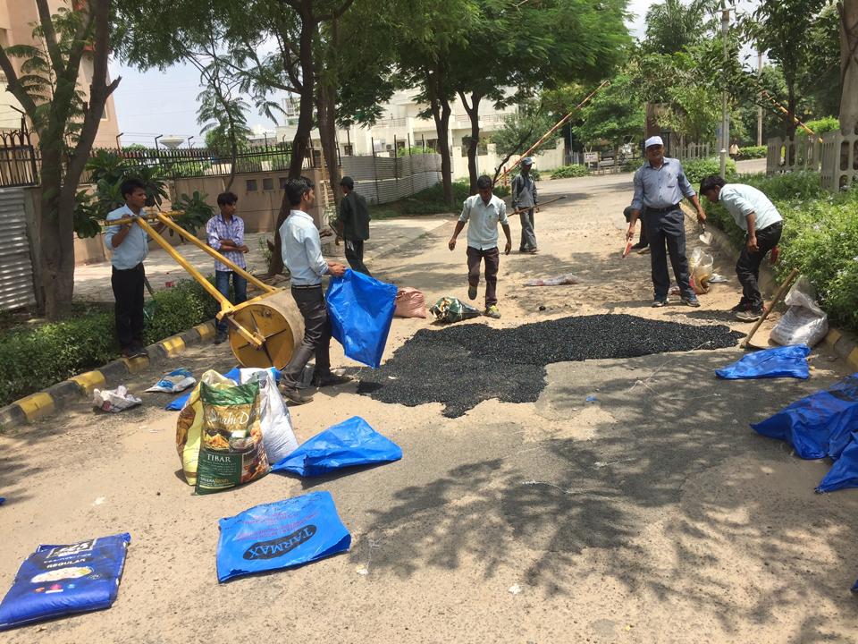 Gurgaon Fresco residents pool funds to repair potholed road Hindustan Times