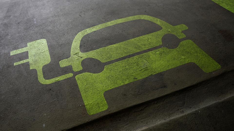 A sign is painted on a parking space for electric cars inside a car park in Hong Kong. (Representational photo)