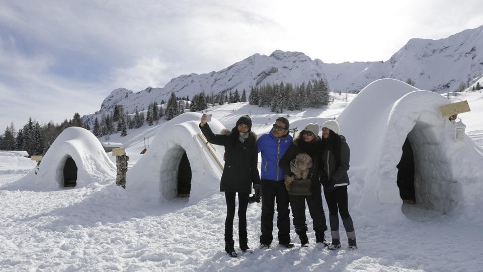 Igloos built by African migrants in tiny Italian Alps village attract