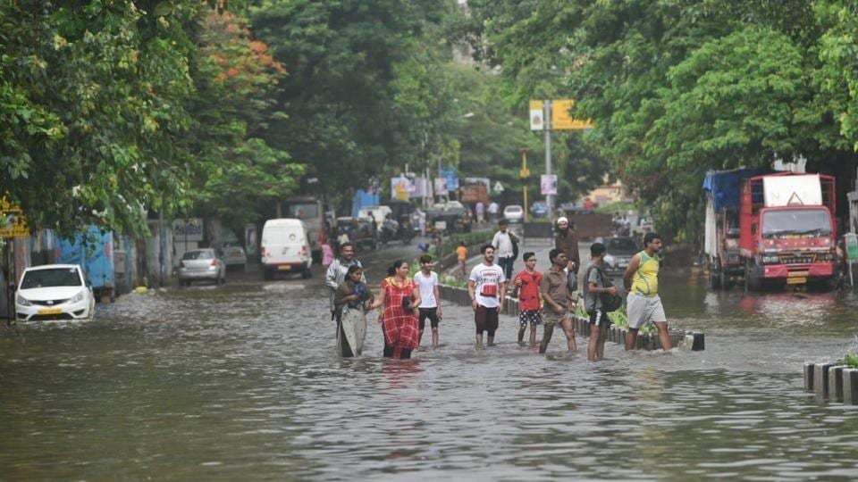 Mumbai rains Highlights: Heavy showers clog roads; wall collapse, road ...