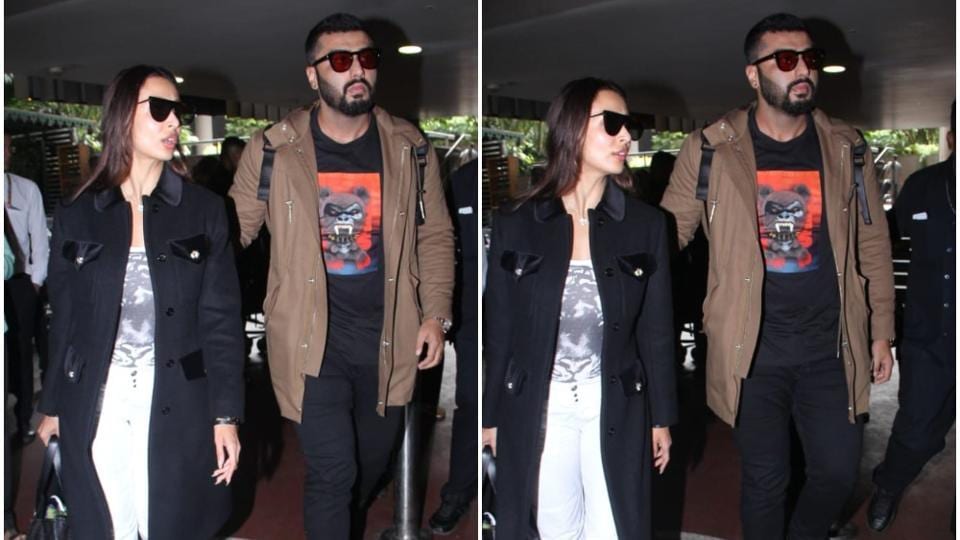 Arjun Kapoor puts a protective arm around Malaika Arora as they return ...