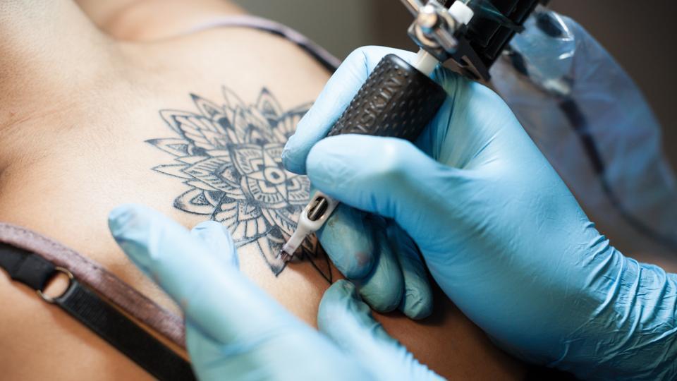 Infected Tattoo: Causes, Stages, & How To Identify It