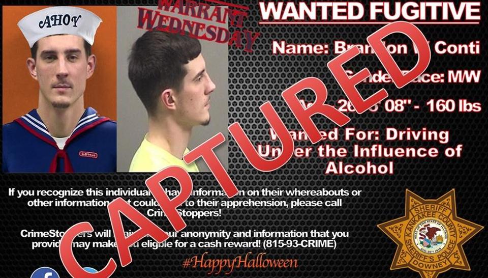 Fugitive asks cops to add costume to his pic, they oblige. Then he does this