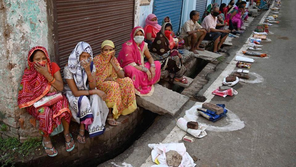 People wait in a queue to collect free ration from a government store in Prayagraj, If anything, the BJP has only expanded the realm of welfare benefits which now includes everything from toilets to tap water. (PTI) People wait in a queue to collect free ration from a government store in Prayagraj, If anything, the BJP has only expanded the realm of welfare benefits which now includes everything from toilets to tap water. (PTI)