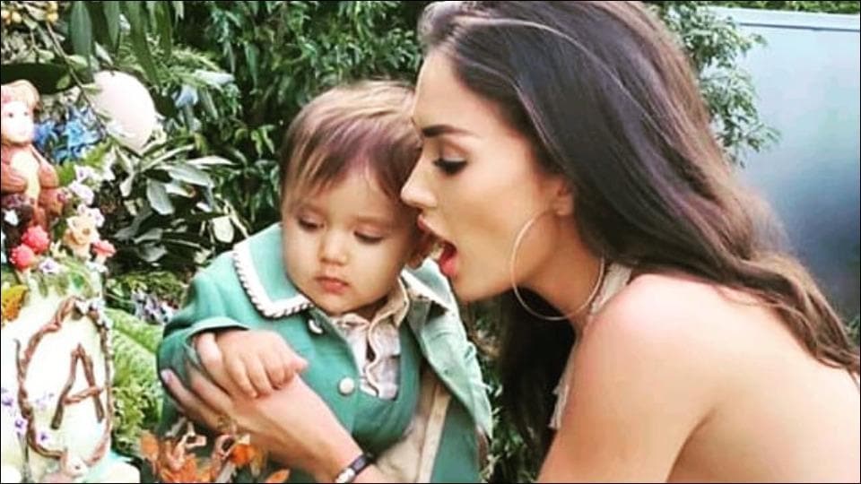 Amy Jackson’s pristine backless dress and son Andreas’ green pantsuit look too charming to miss