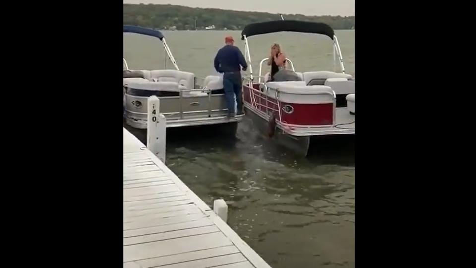 man falling off yacht