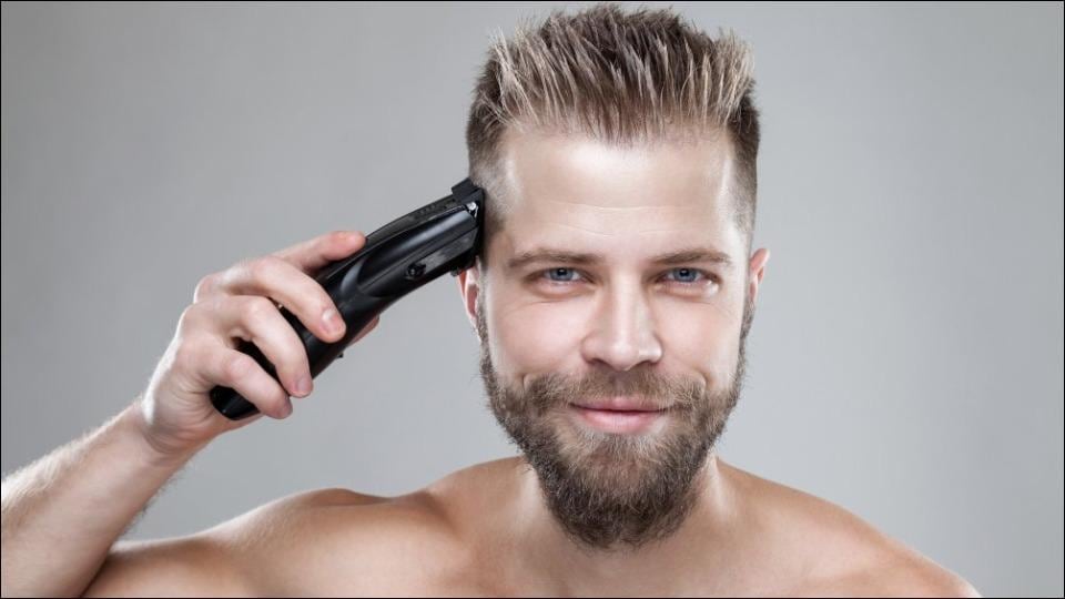 Hairdresser Cuts Woman Client with Trimmer a Short Haircut Shaved Temple  and a Drawing on the Hair Stock Image  Image of indoors mirror 181731943