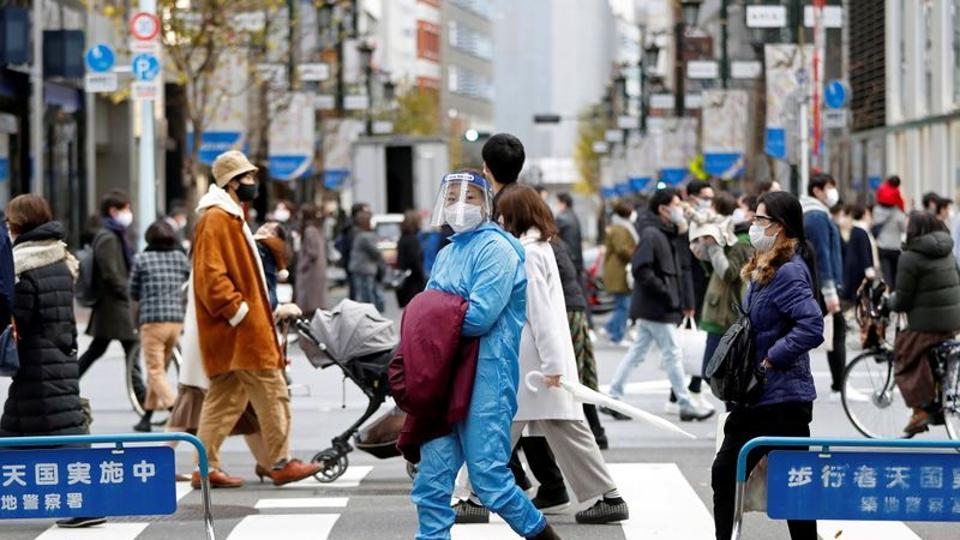 Japan bans new entries of foreigners after new coronavirus variant