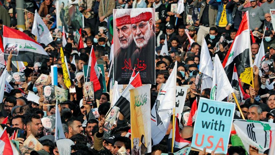 Iraqis chanting anti-US slogans mark year since Soleimani killing